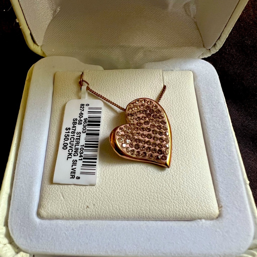Sterling silver rose gold CZ covered heart pendant on 18” chain.